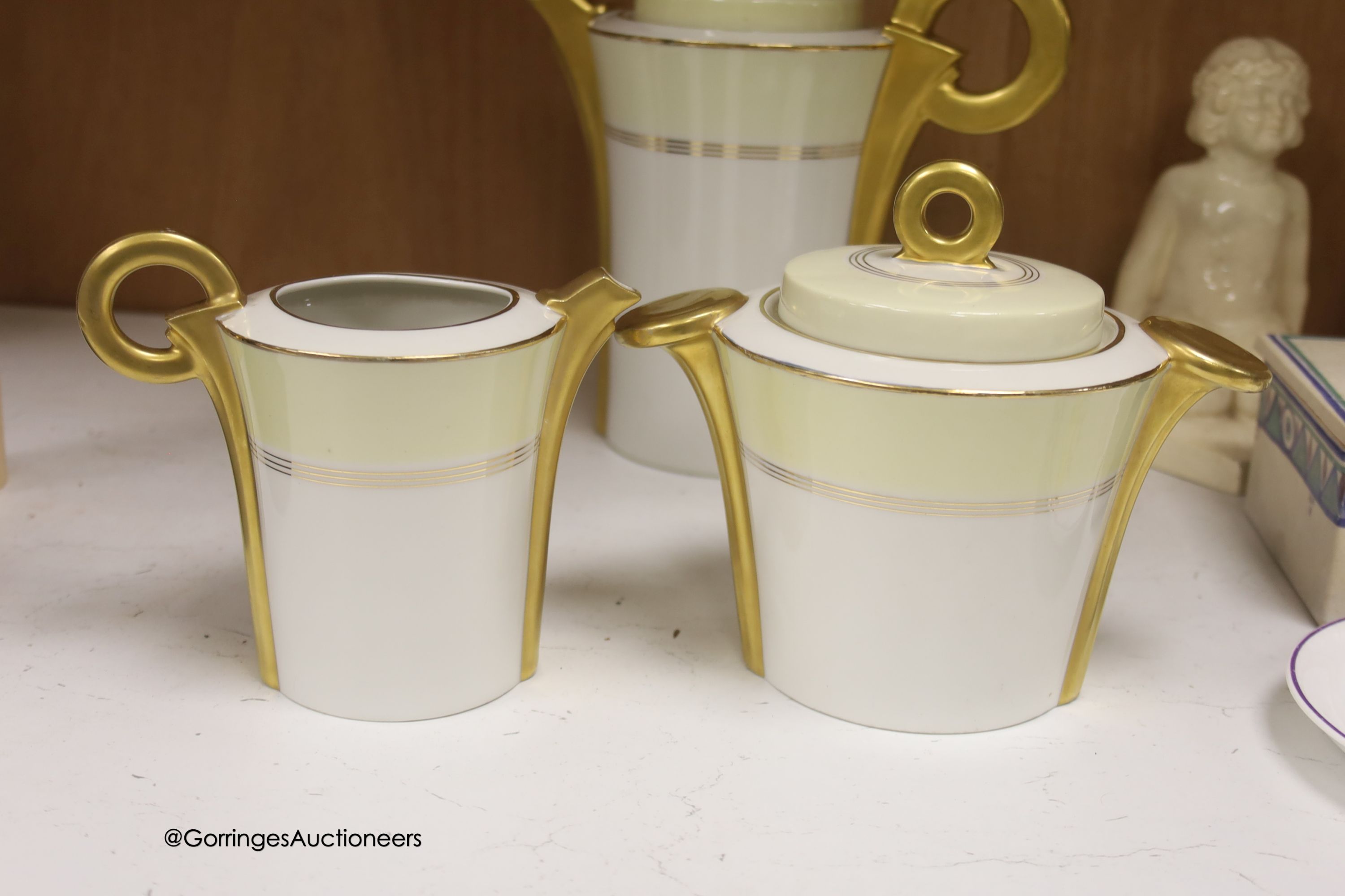 A Carter, Stabler & Adams Poole square serving dish, with cover, width 13cm, a pair of white glazed earthenware nude bookends, a Limoges teaset and three other items